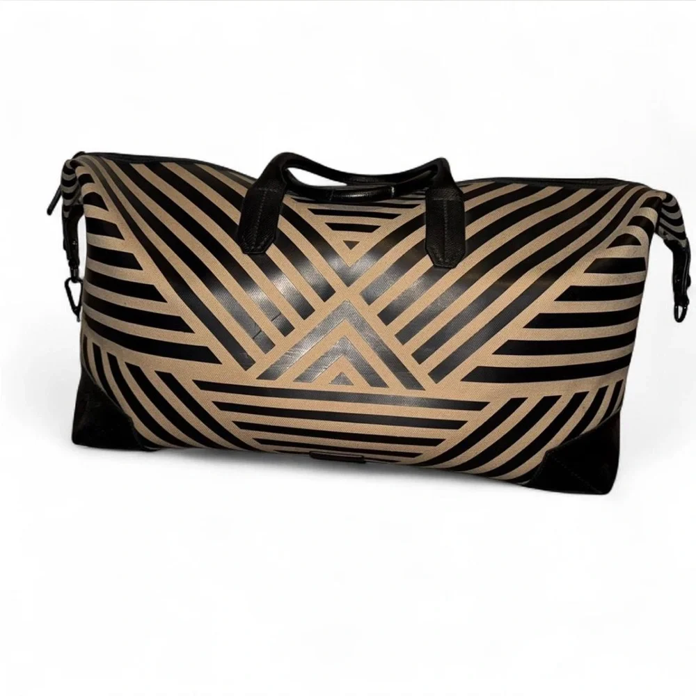 Uri Minkoff tan and black leather geometric design travel bag